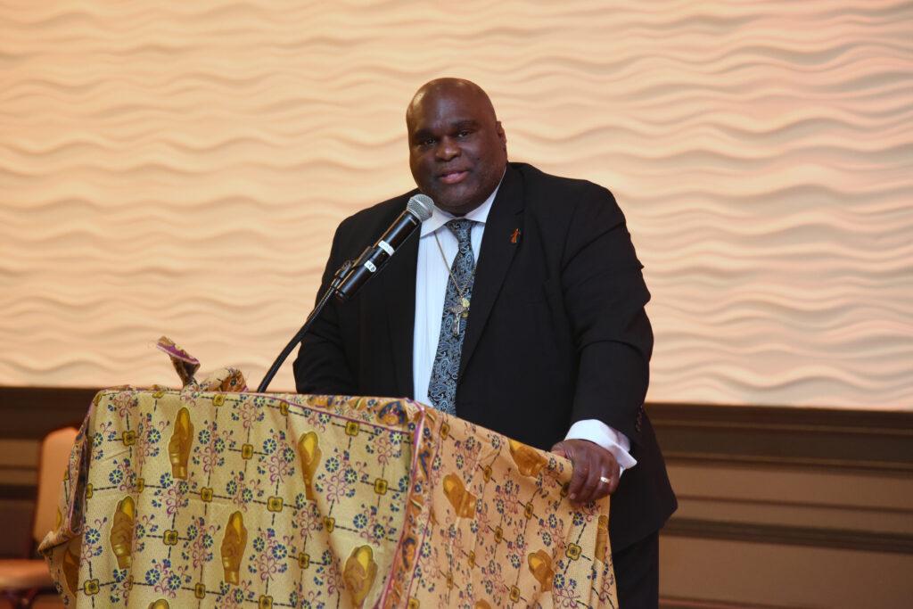 Deacon Harold Burke Sivers speaking at a podium