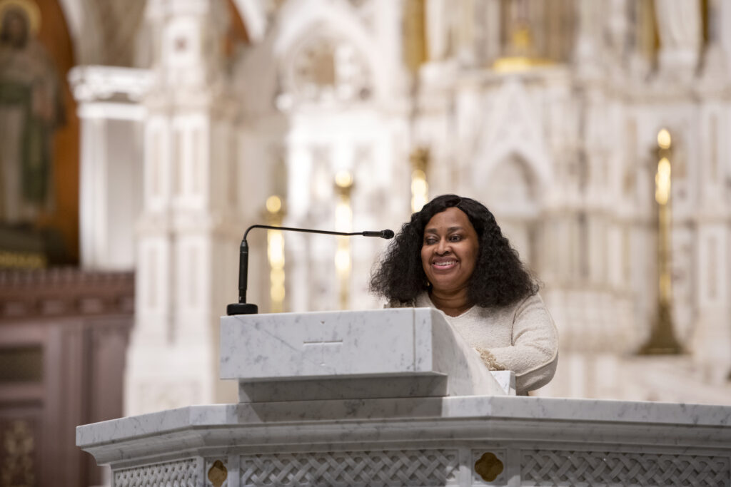 Woman speaking in front of the Cathedral