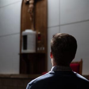 Man praying before the tabernacle